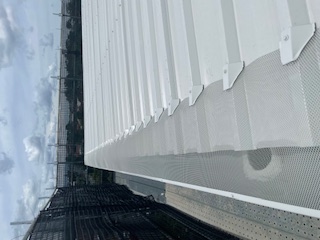 Commercial gutter guard installation on white roof